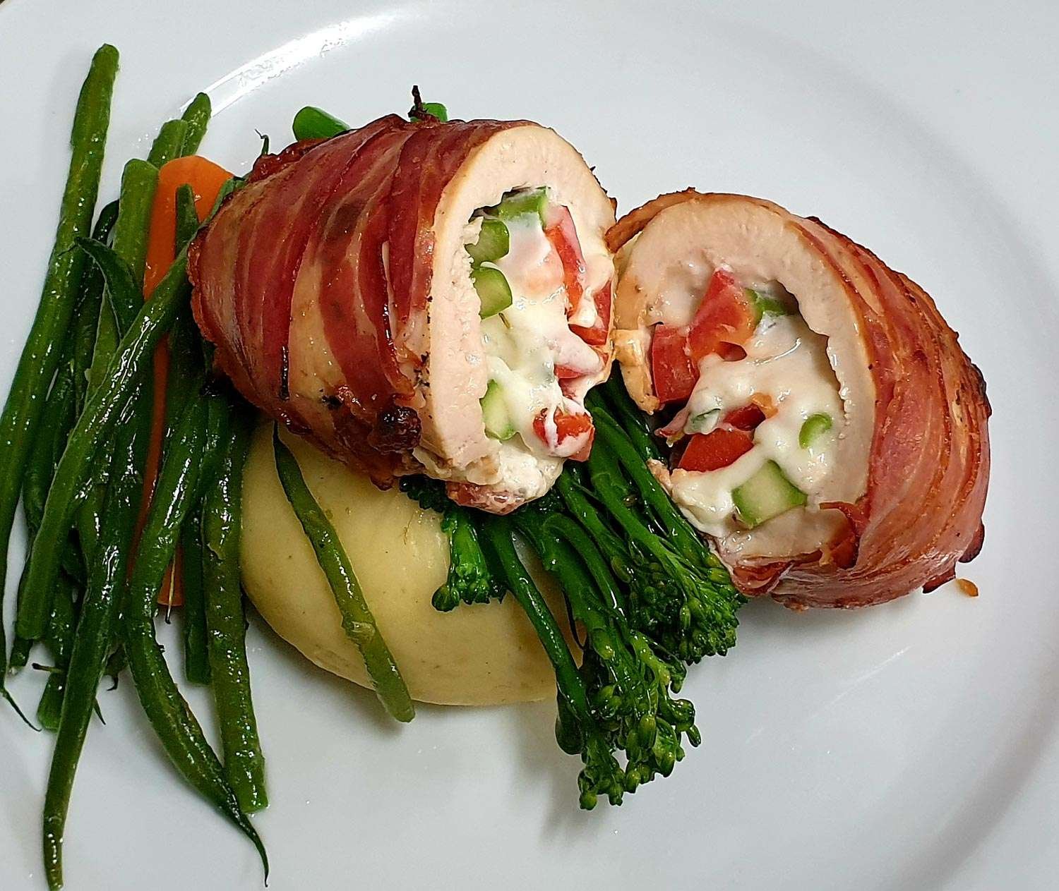 Bacon-wrapped stuffed chicken